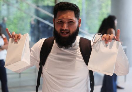Apple fans, customers react as iPhone Duo hits stores | live
